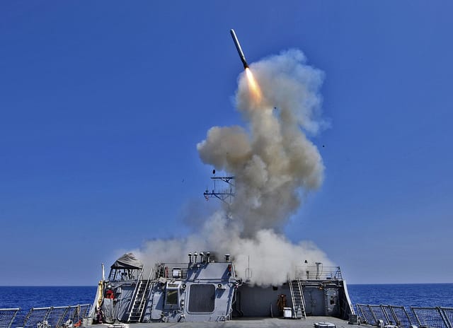 A U.S. Navy Destroyer fires a Tomohawk Cruise Missile.